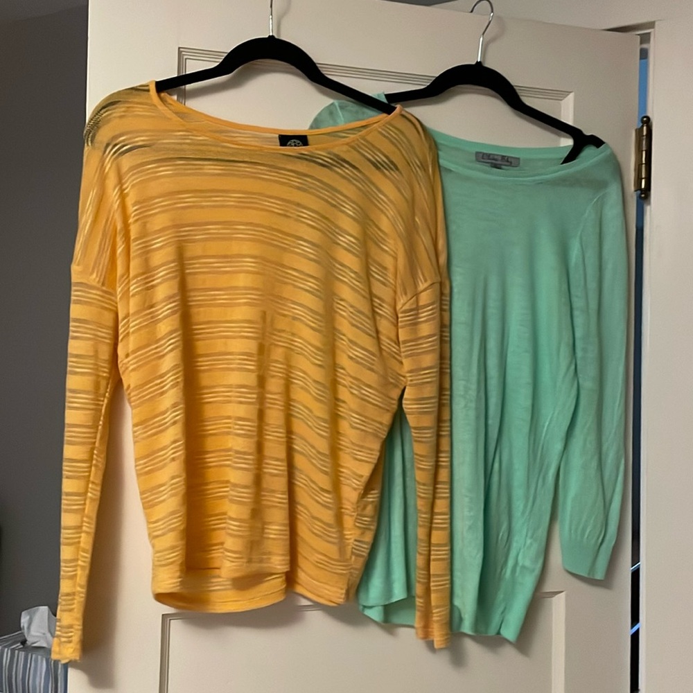 Two bright colored lightweight sweaters. One yellow one green.